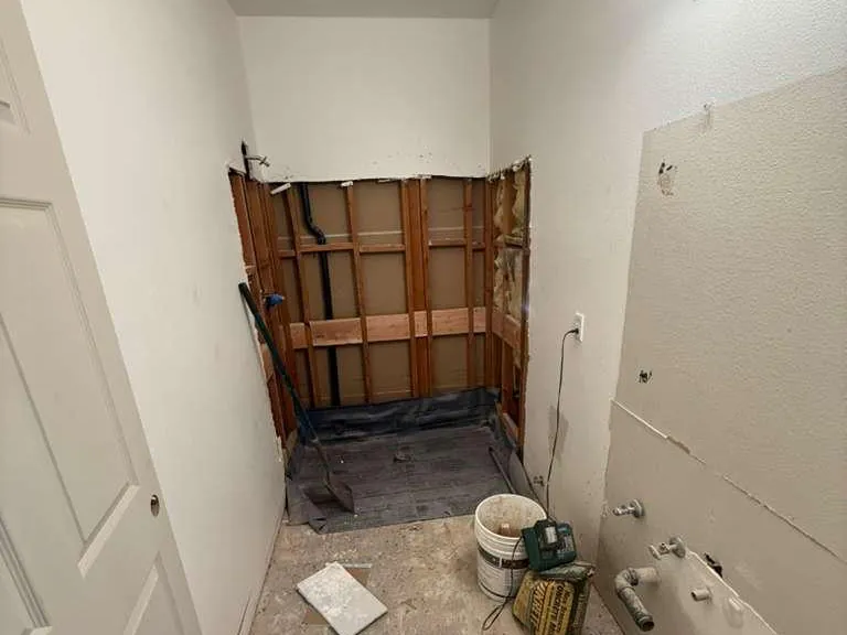 Skyland residence — bathroom stripped for reconfiguration